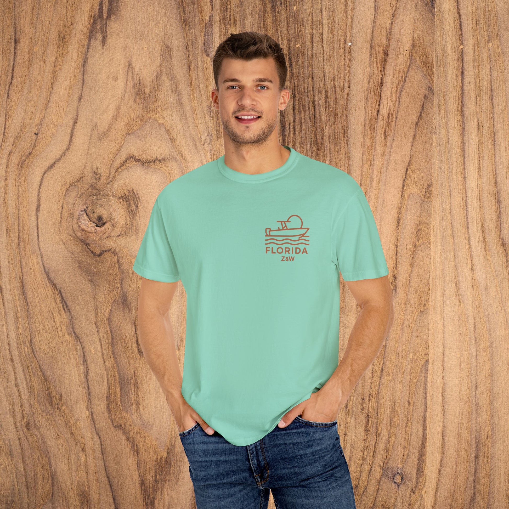 Model wearing the Unisex Florida Graphic Tee in mint green, featuring a unique boating graphic. Ideal for casual occasions, this comfortable tee is made from high-quality US cotton and available in sizes S-4XL.