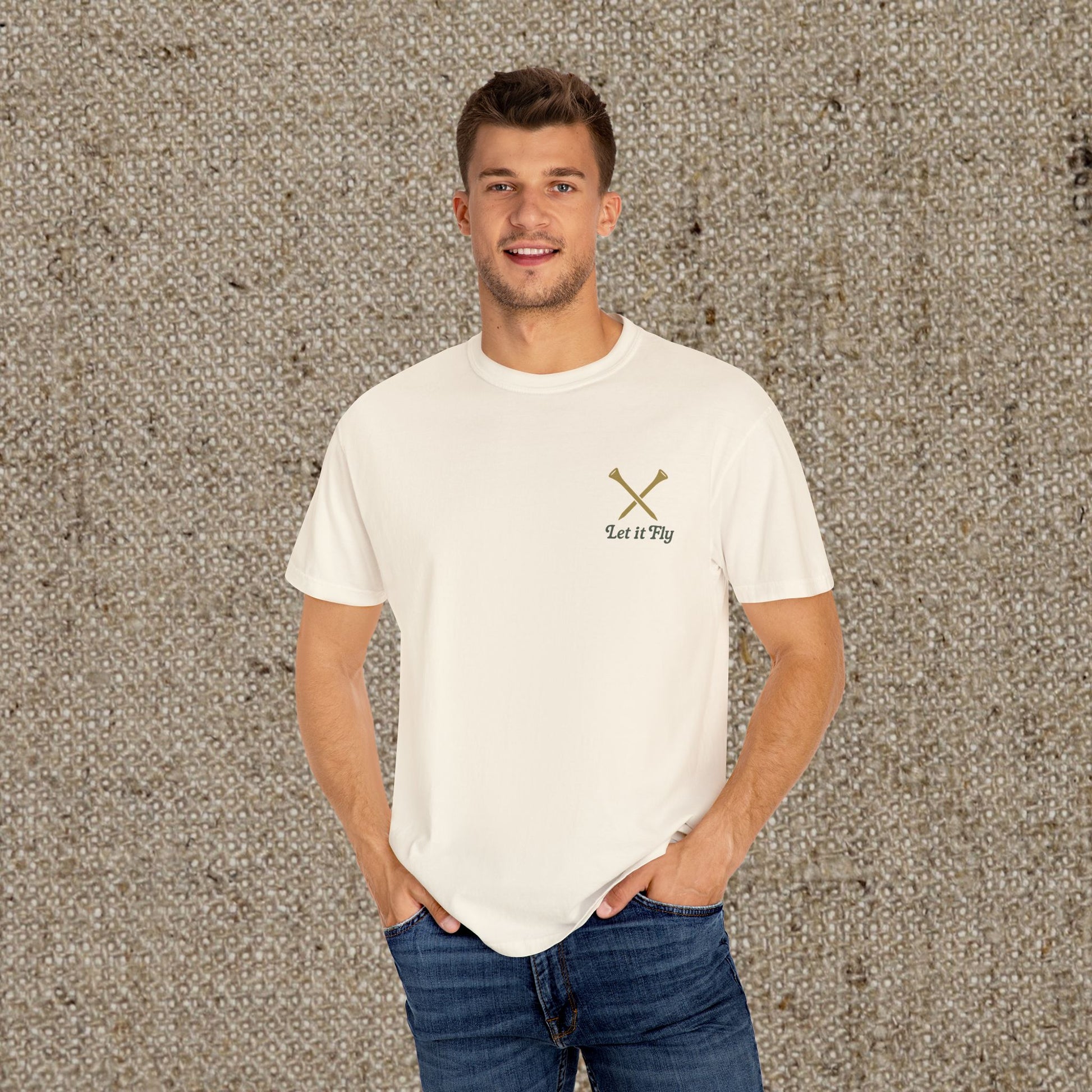 Man wearing the Tee It High Let It Fly Graphic Tee, featuring a classic beige color and golf-themed design, ideal for any occasion and made from durable, comfortable cotton.