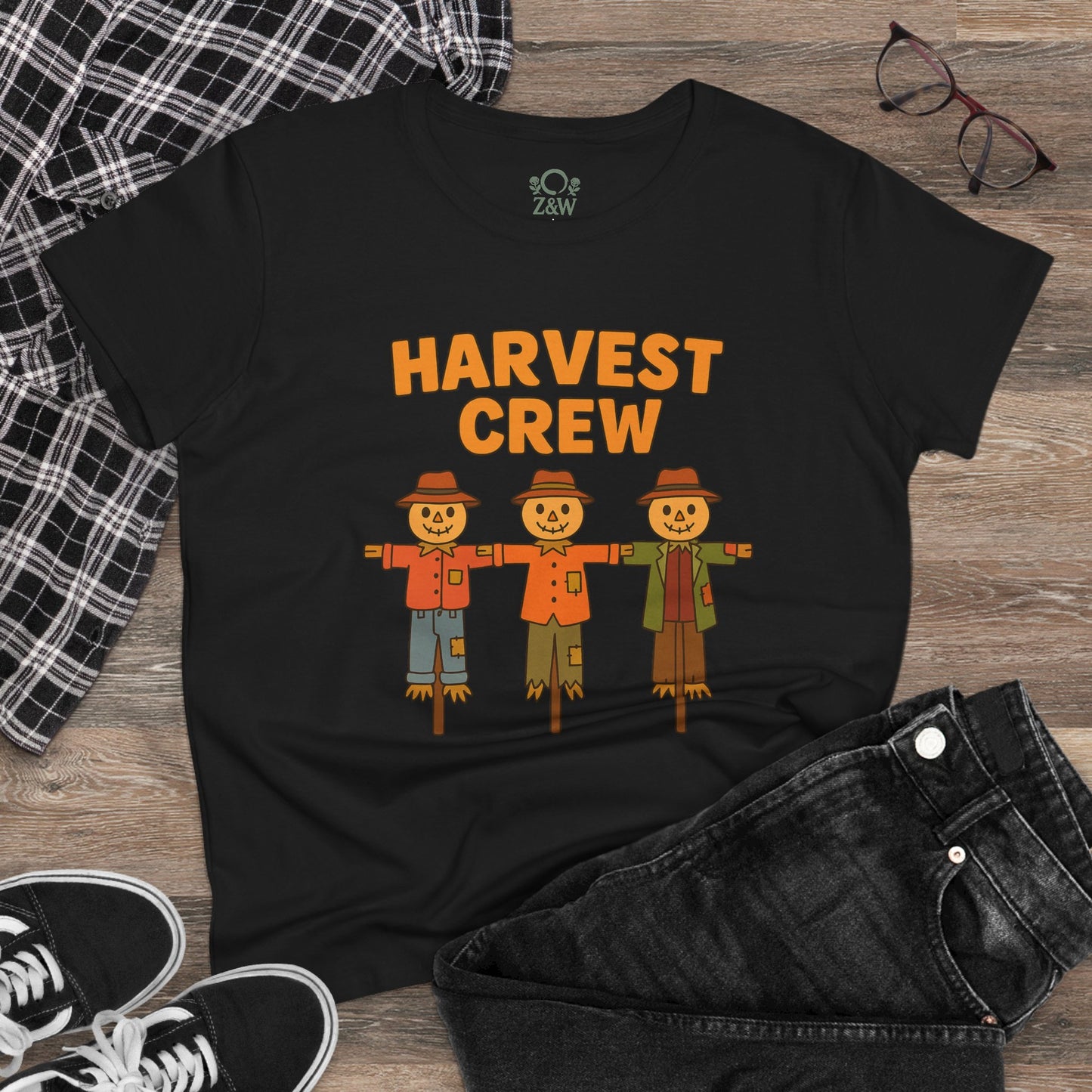 Harvest Crew Halloween T-Shirt featuring three cartoon scarecrows on a black shirt, made from soft 100% ring-spun cotton, perfect for festive wear.