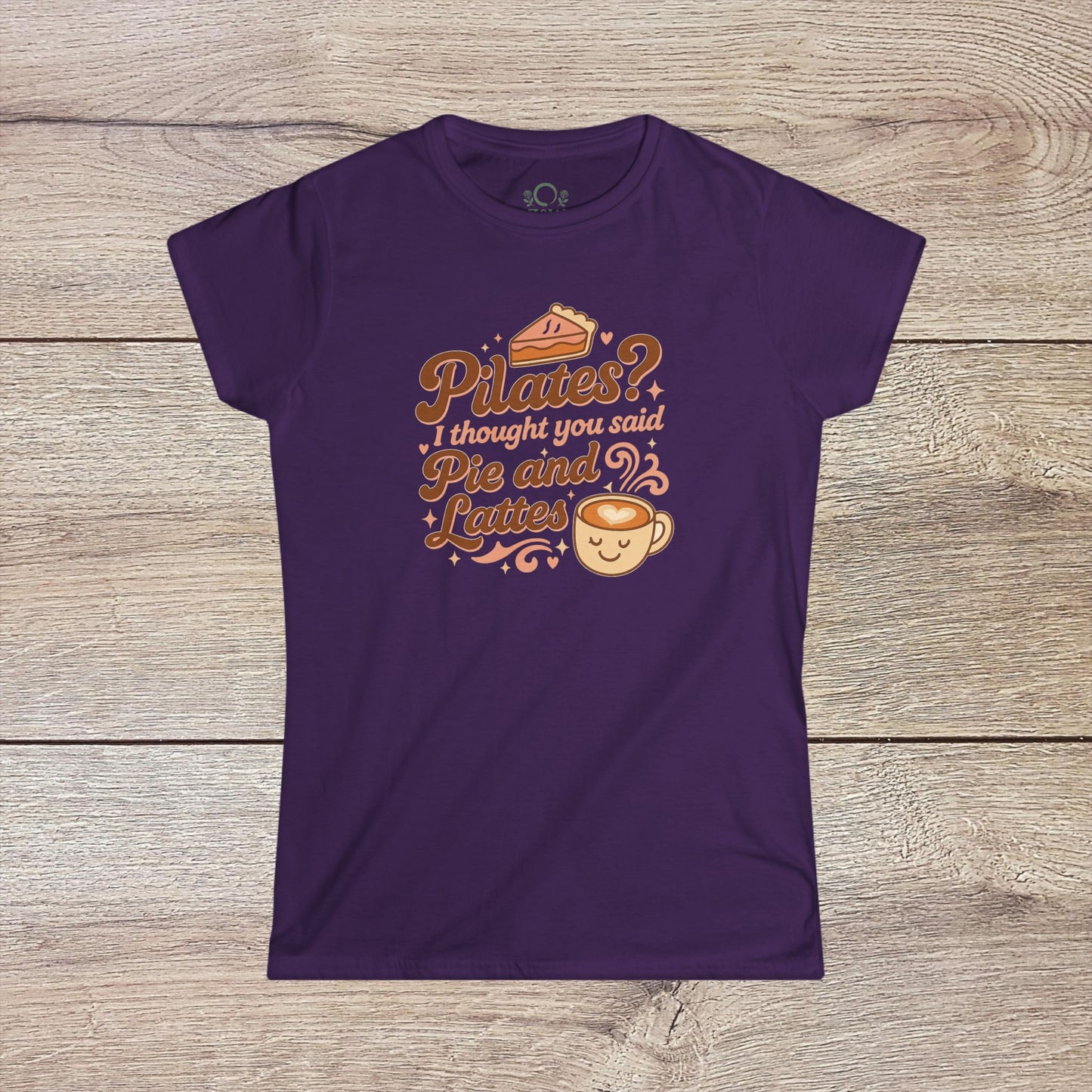 Funny Pilates T-Shirt in a rich purple color displaying the funny saying: 'Pilates? I thought you said Pie and Lattes'. Built with durable shoulder tape and a classic fit.