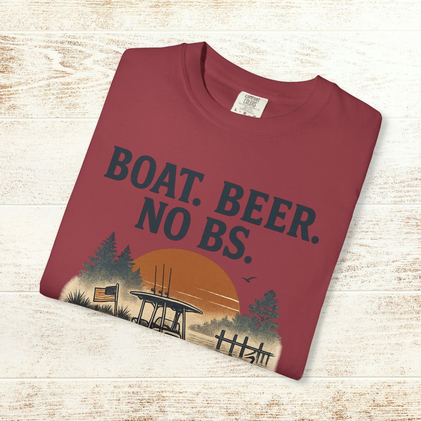 Close-up of the Boat Beer No BS Tee in maroon, highlighting the bold text and artistic design of a sunset scene.