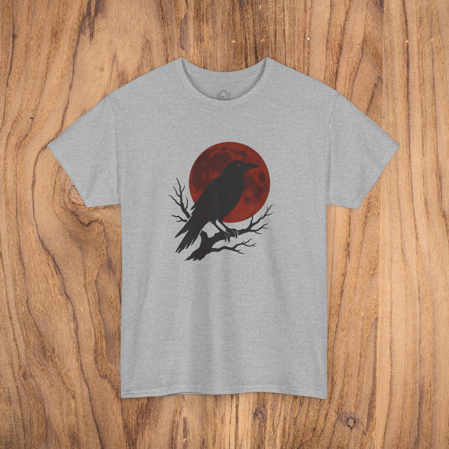 Gothic Raven T-Shirt in heather gray, featuring a distinctive raven silhouette set against a red moon, perfect for festive fall fashion and Halloween celebrations.