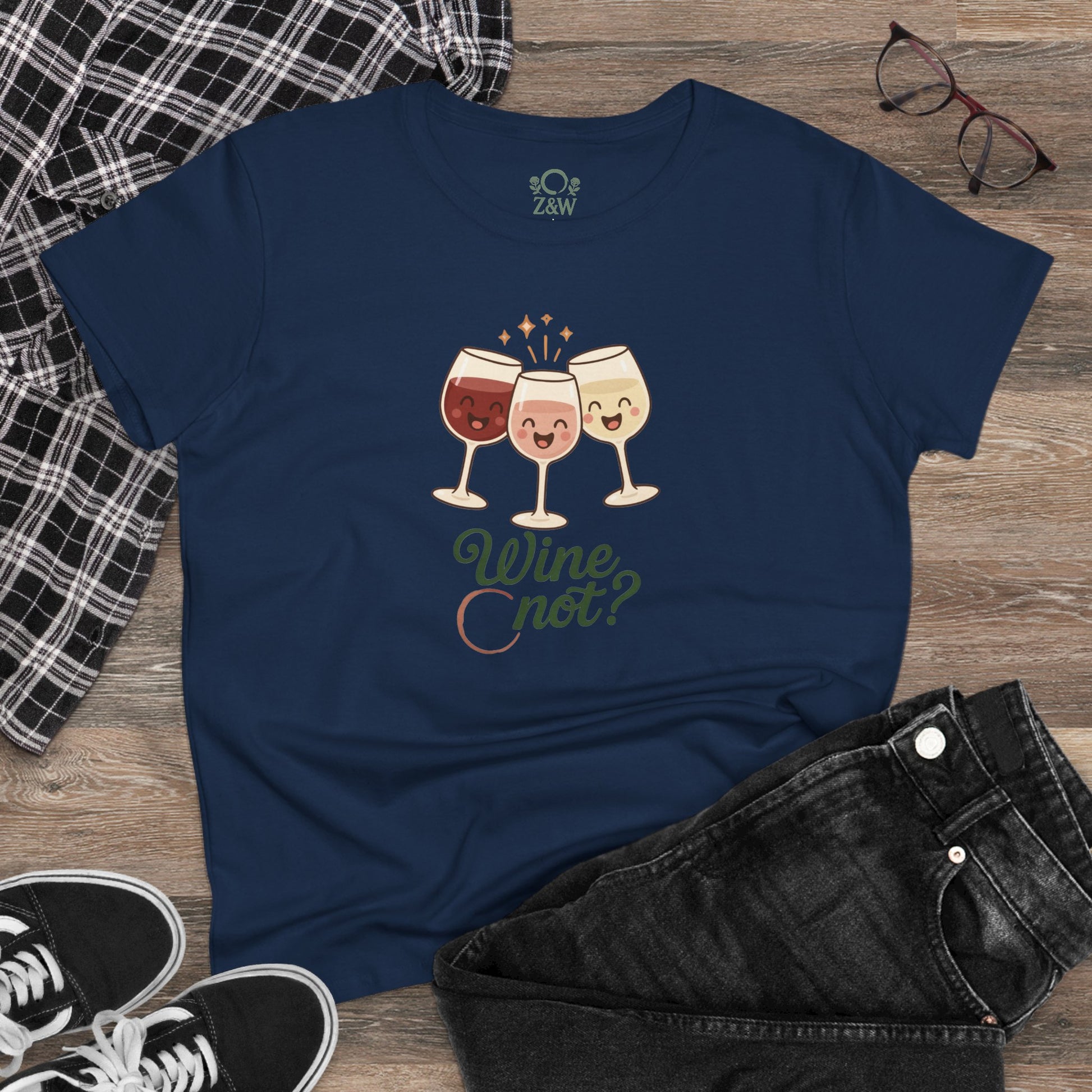 Wine Not Tee displayed on a flat lay with a casual outfit, featuring playful cartoon wine glasses on a dark navy t-shirt, appealing to wine enthusiasts.