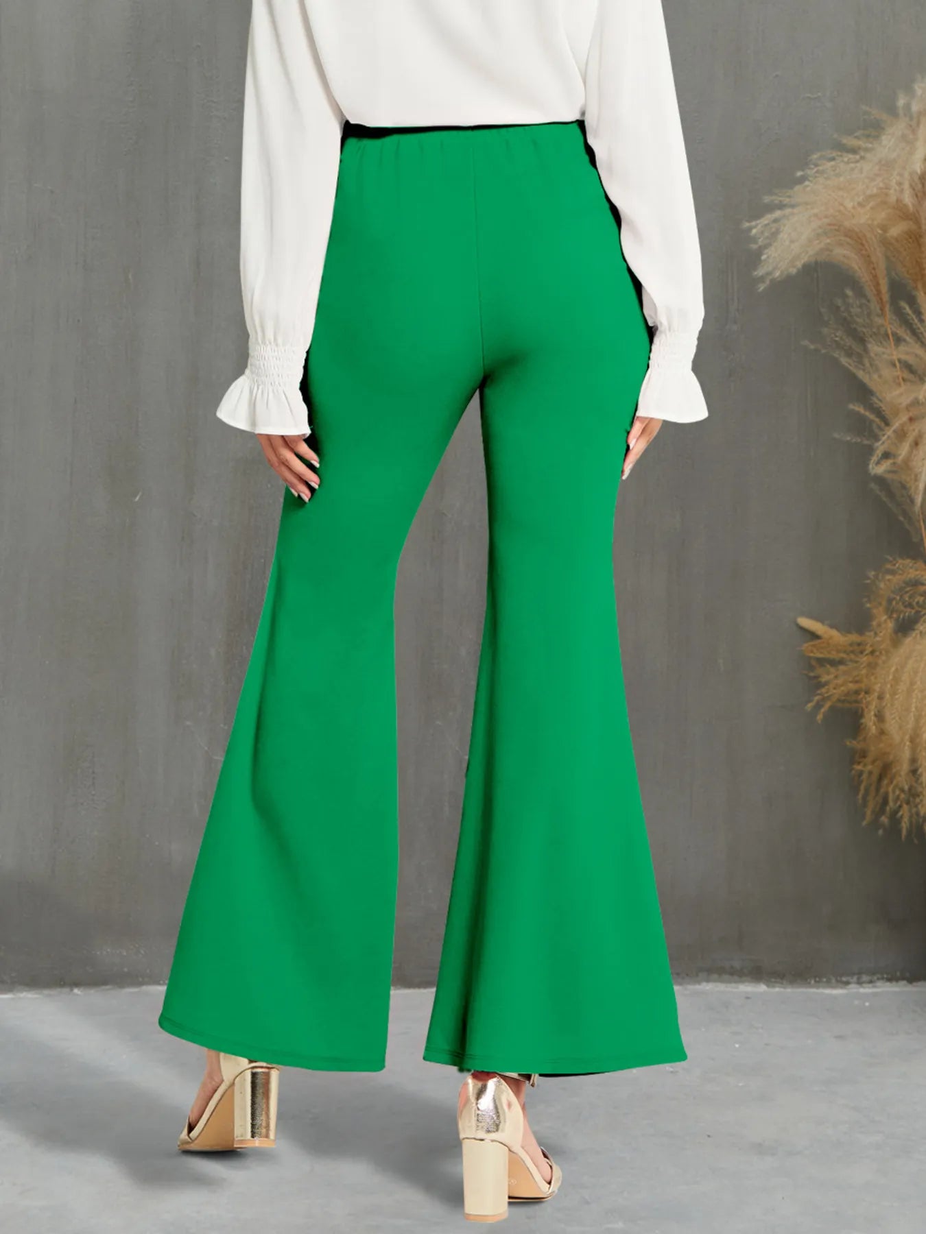 Stylish High Waisted Flare Pants with Decorative Buttons - Back view in green, capturing the comfortable waistband and stylish flare for an elegant look.
