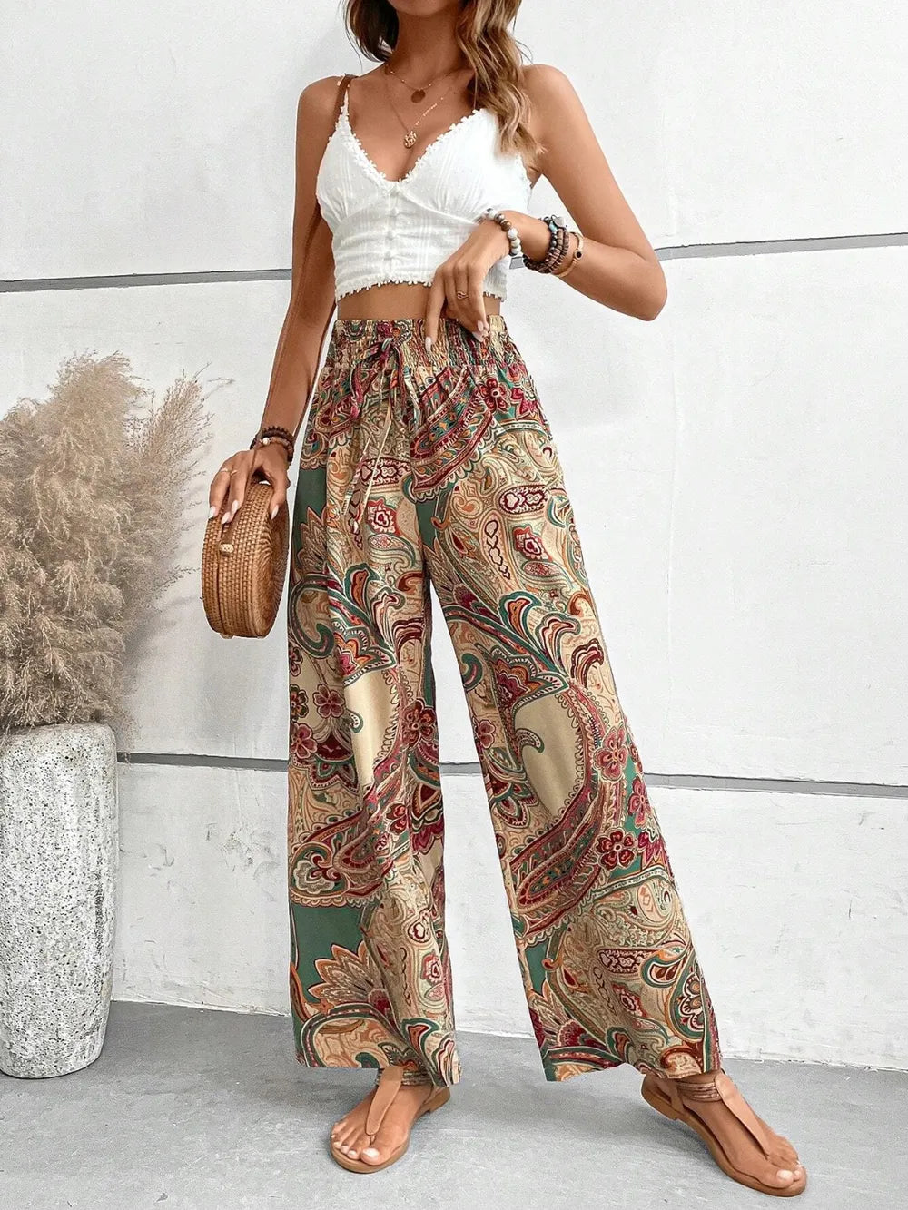 Close-up view of Trendy Printed Wide Leg Pants with Tied Detail in a colorful paisley print, highlighting the fabric and style, a great choice for any occasion.