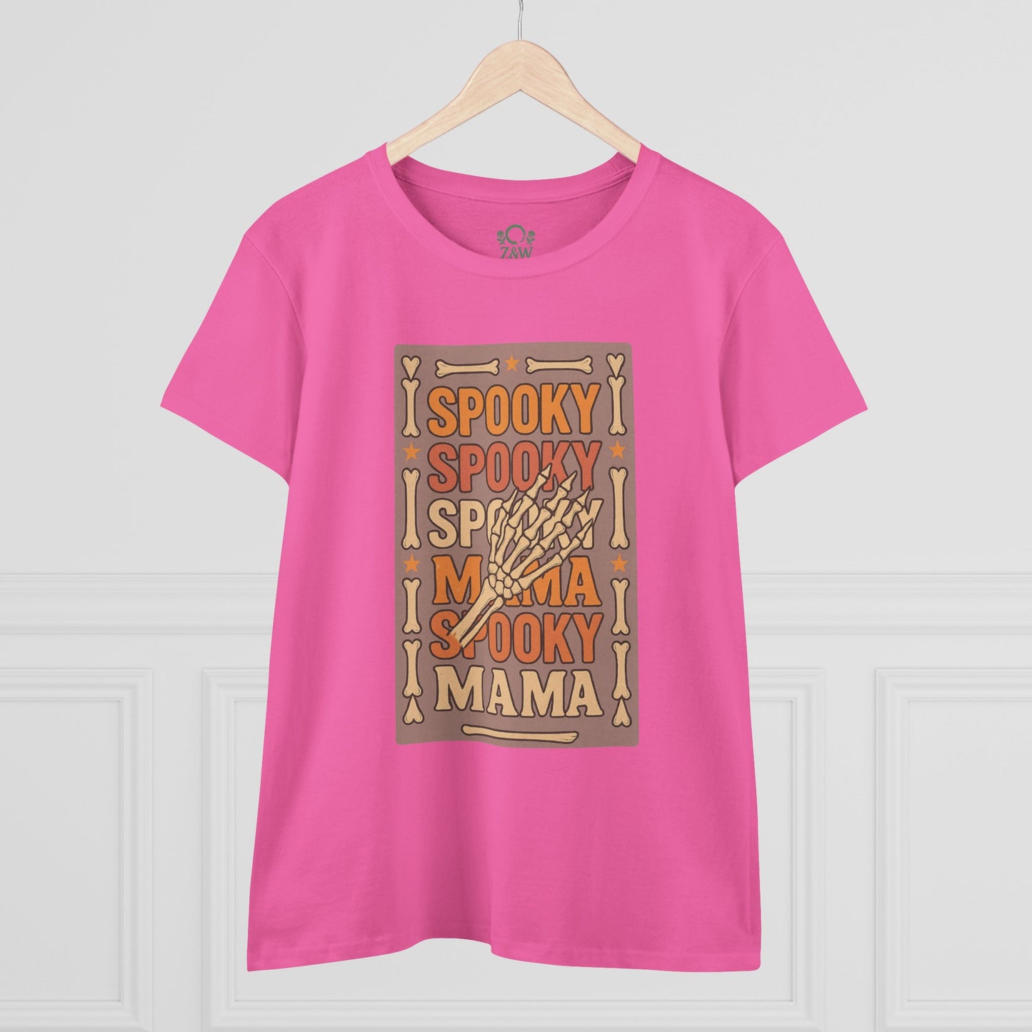 Front view of the Spooky Mama Tee featuring a playful skeleton hand design on a bright pink background, perfect for festive occasions.