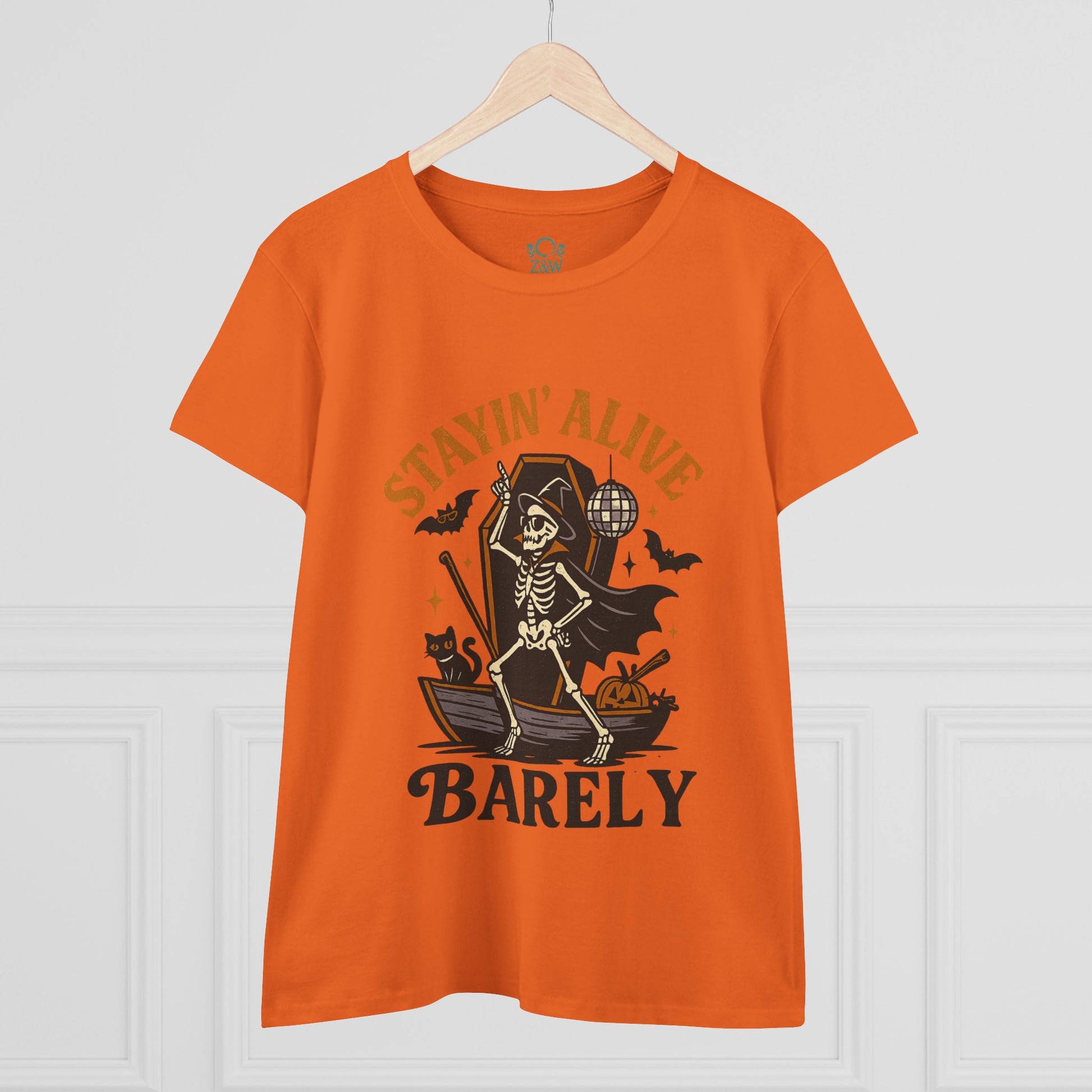 Front view of the Stayin’ Alive T-Shirt in orange, showcasing a playful skeleton design, a great choice for Halloween festivities.