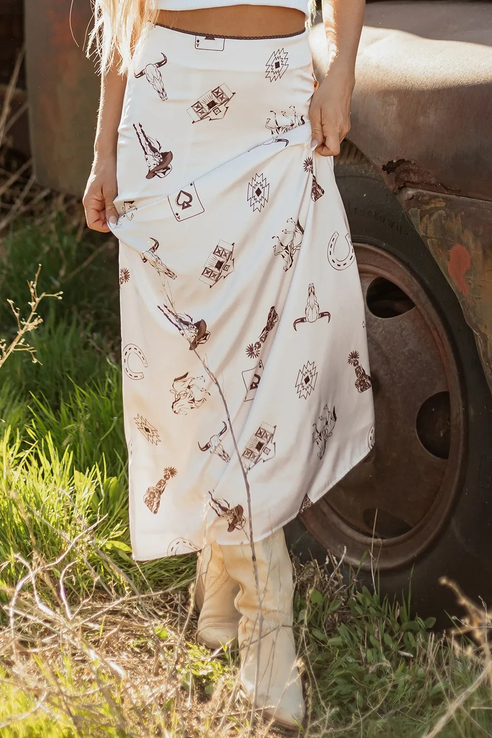 Trendsi Western Print Satin Long Skirt showcased outdoors, featuring a stylish western print, made from 97% polyester, perfect for elegant summer wear.