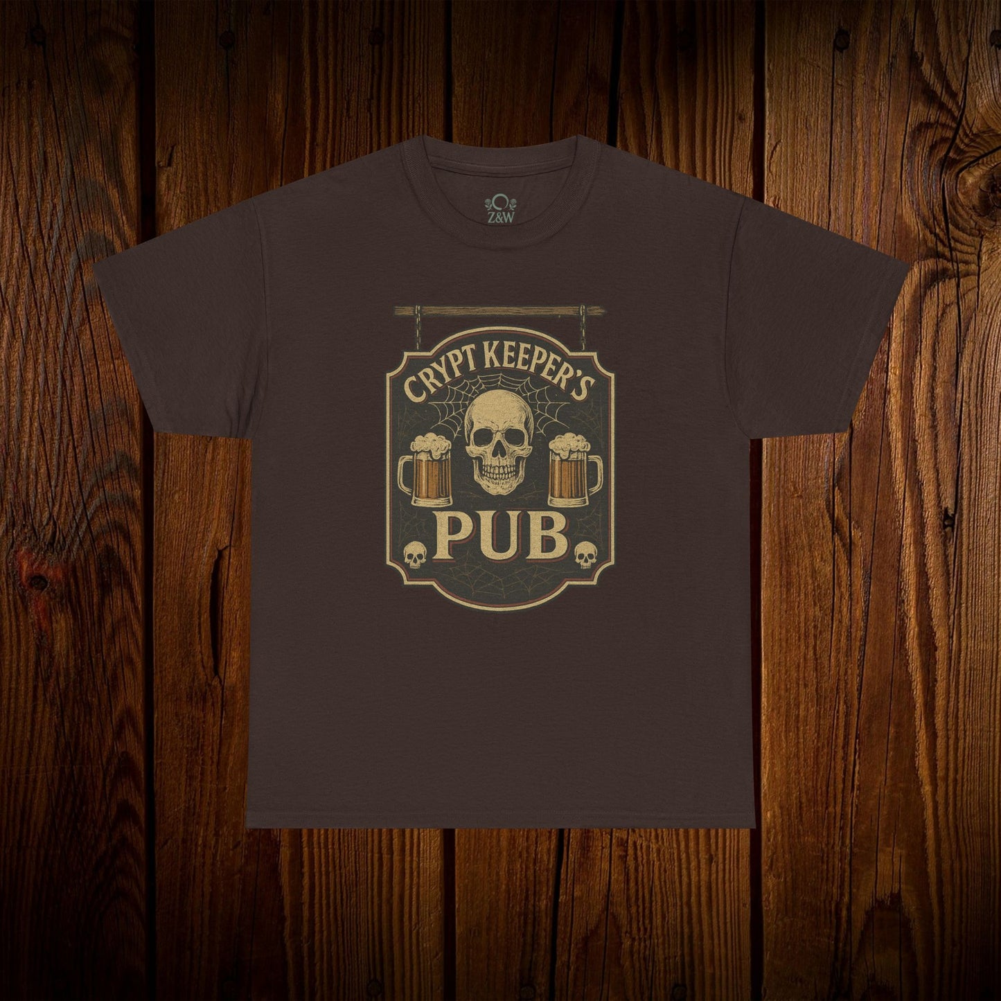 Crypt Keeper's Pub Tee in dark brown color, featuring a skull and beer mugs design, perfect for Halloween, pub crawls, and casual wear.
