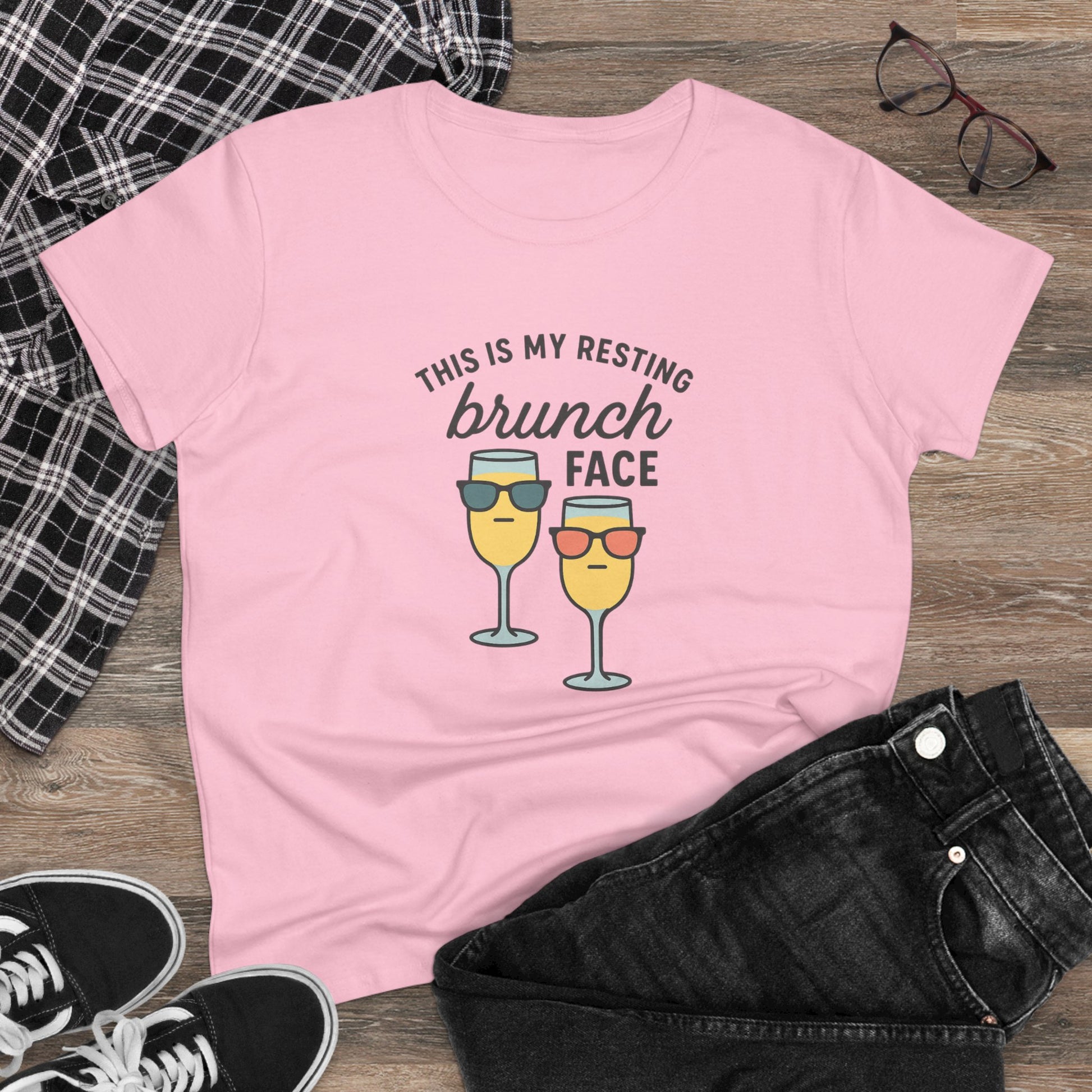 Front view of Women's Premium 100% Cotton Brunch Face Tee featuring a playful design with two glasses and the phrase 'This is my resting brunch face' in pink.