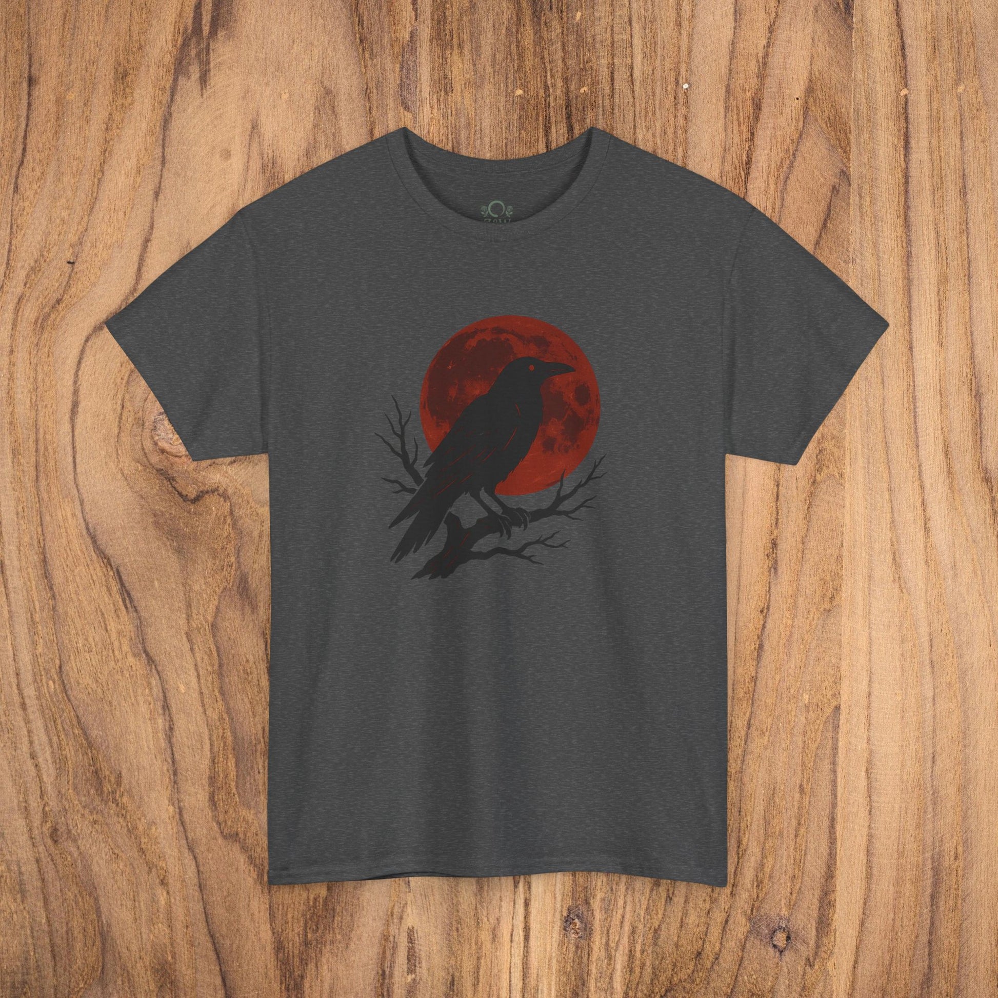 Gothic Raven T-Shirt in charcoal gray, highlighting a dramatic raven silhouette with a red moon backdrop, ideal for casual fall style and unique Halloween gifts.