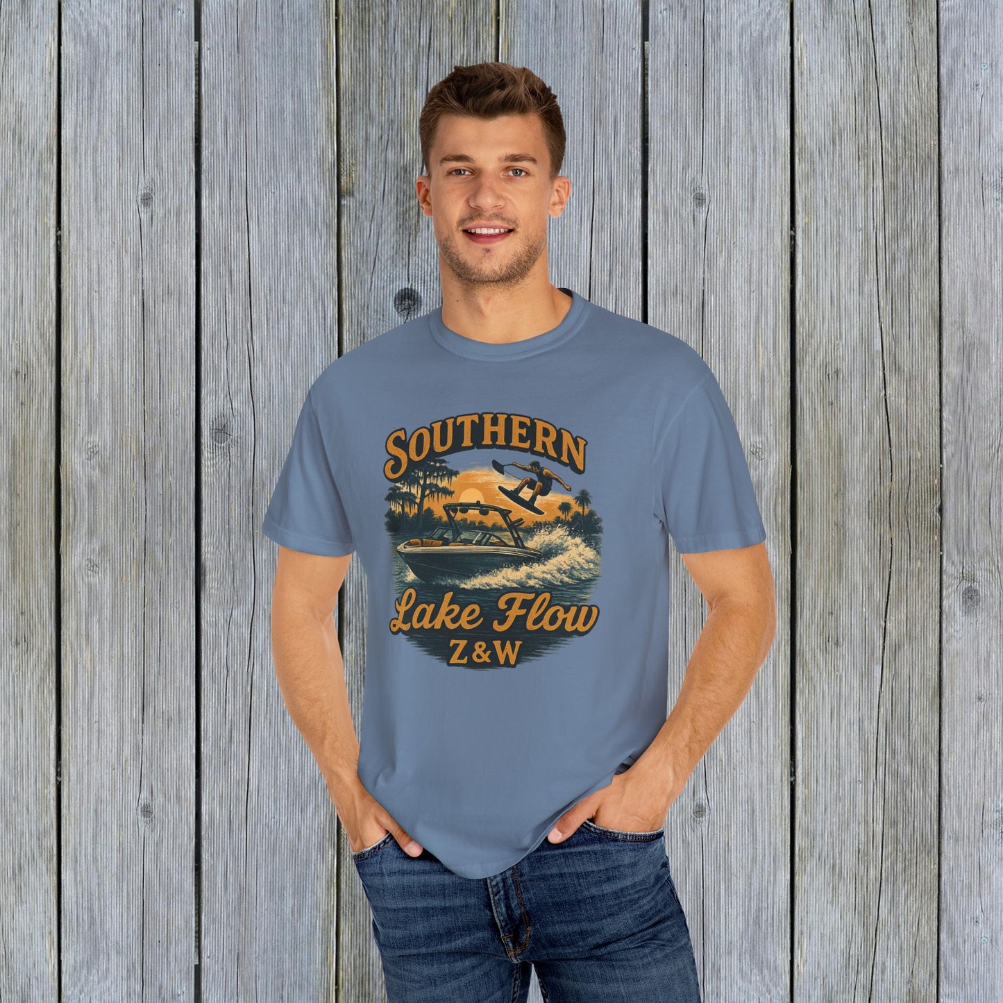 Southern Lake Flow T-Shirt worn by a model in a blue color, made from eco-friendly 100% US cotton, showcasing its stylish design.