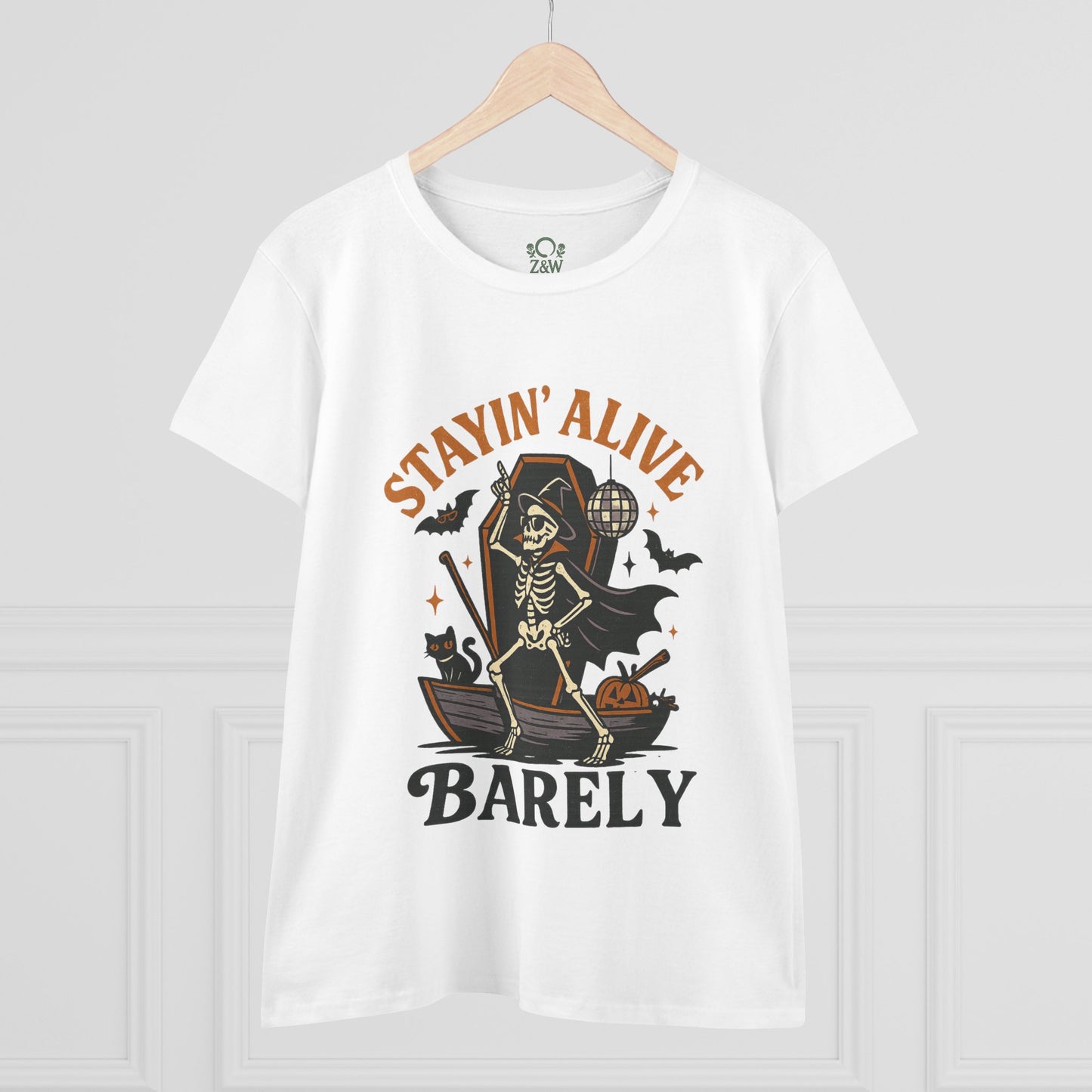 Front view of the Stayin’ Alive T-Shirt featuring a skeleton dressed in a cape for Halloween, embodying a playful spirit.