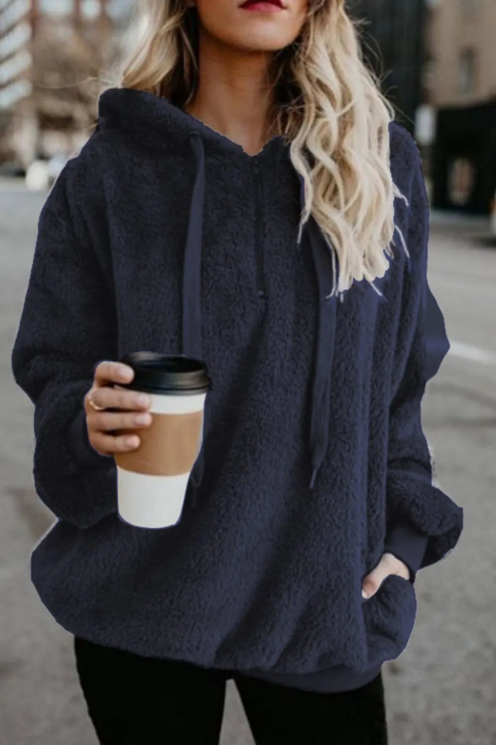 Cozy Full Size Teddy Hoodie with Quarter-Zip and Drawstring worn by a woman holding a coffee cup, showcasing its casual style and comfort in navy blue.