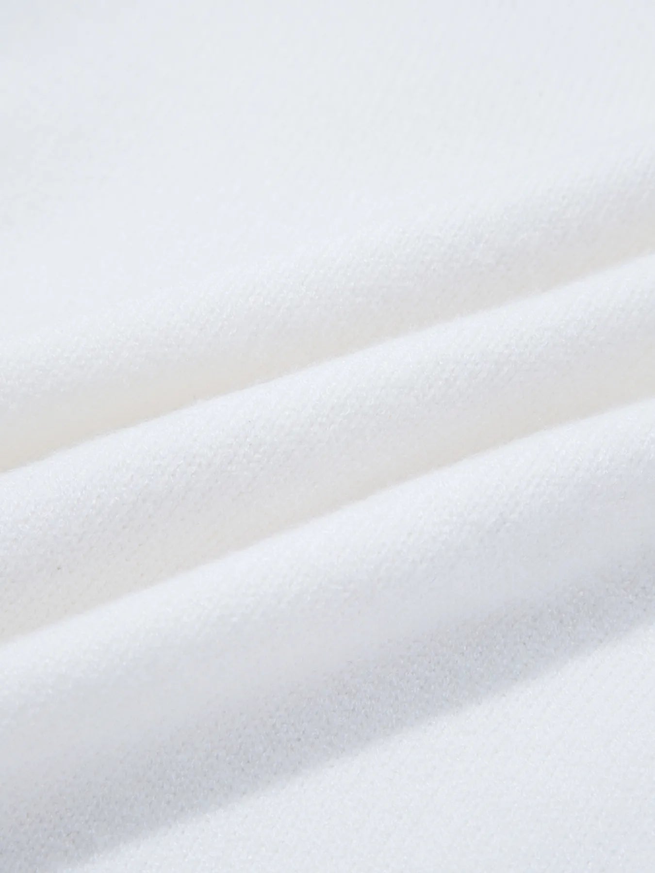 Textured close-up of the fabric on the Western Style Knit Crew Neck Sweater with Horseshoe Star, highlighting the soft and slightly stretchy material.