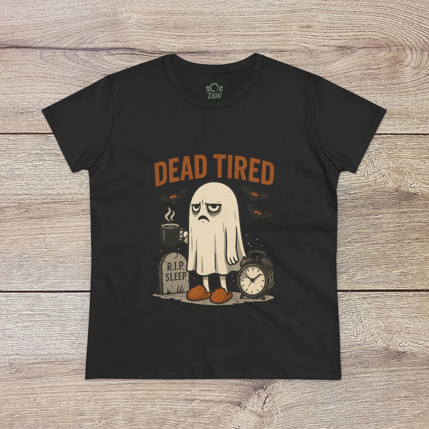 Cute Whimsical Ghost T-Shirt for Halloween with a 'Dead Tired' ghost print on a black shirt, designed from 100% cotton for a comfortable, unisex fit.