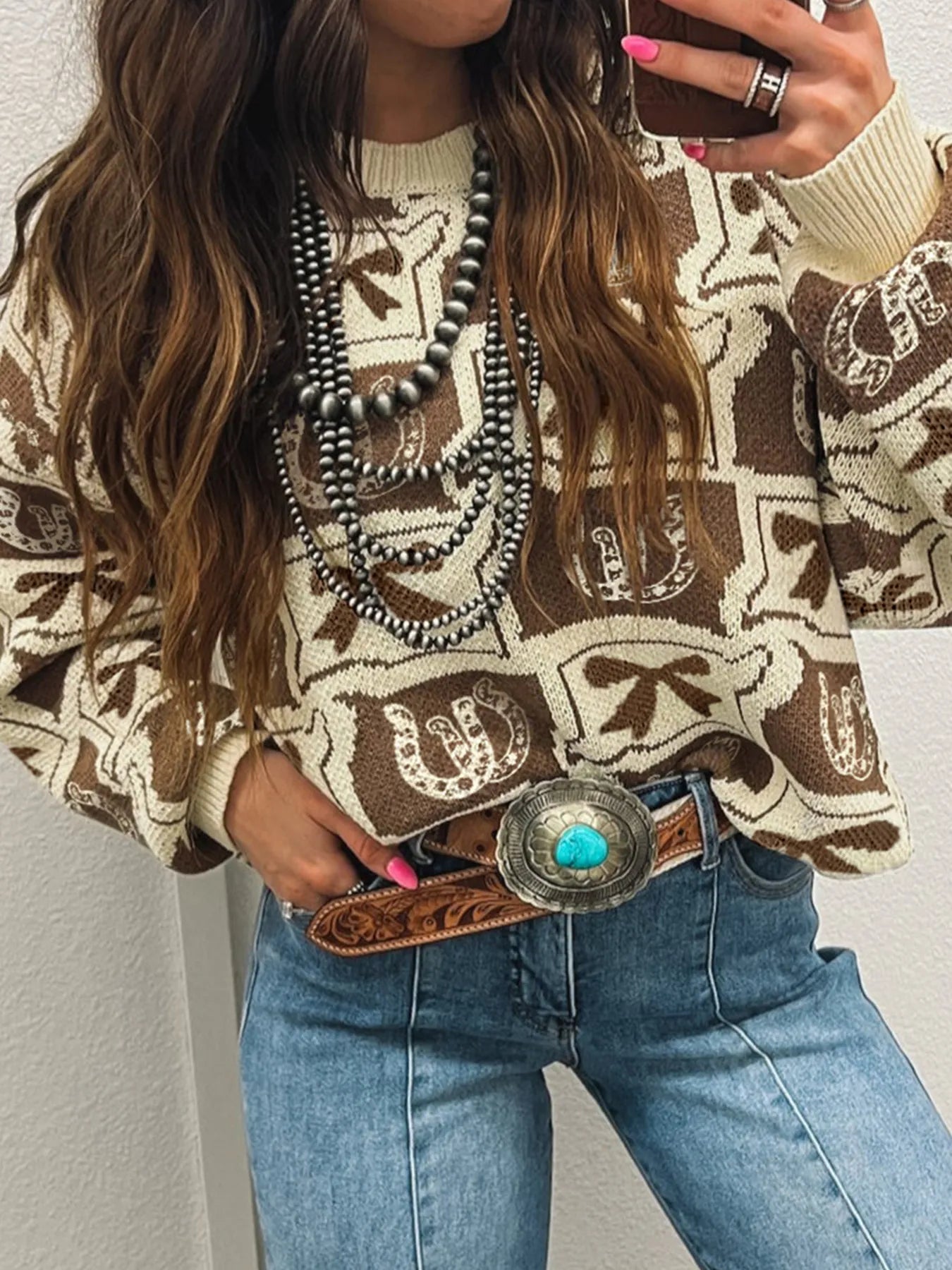 Trendy Graphic Round Neck Long Sleeve Sweater - Soft Viscose Blend with Stretch, featuring a stylish design, paired with high-waisted jeans and detailed with layered necklaces, perfect for casual attire.