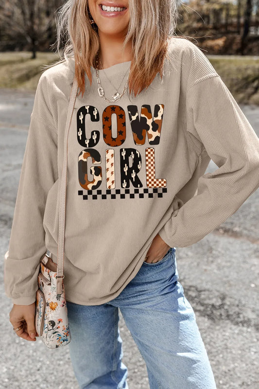 Cowgirl Graphic Long Sleeve Sweatshirt featuring a stylish design and comfortable fit, perfect for casual outings. Model showcasing the sweatshirt with jeans.