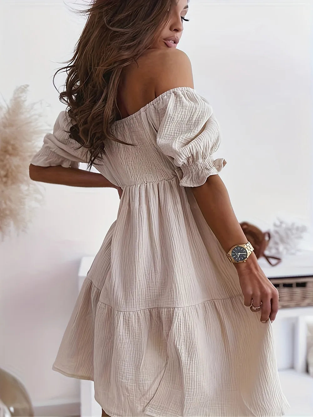 Chic full size ruffled off-shoulder dress with short sleeves, highlighting a stunning back angle, great for summer events.