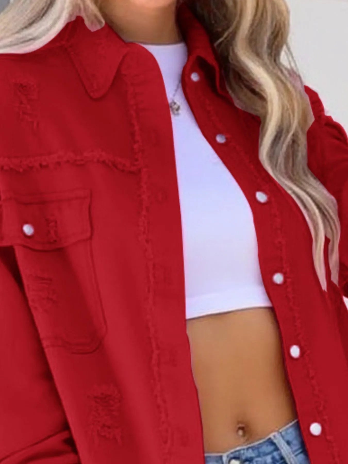 Close-up of the Oversized Distressed Denim Jacket with Frayed Edges and Buttoned Pockets in red, showcasing stylish details for casual looks.