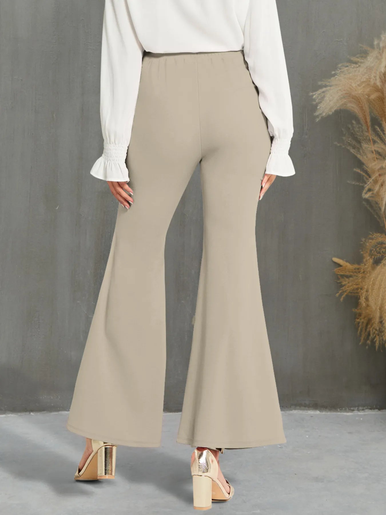 Stylish High Waisted Flare Pants with Decorative Buttons - Back view highlighting the comfortable fit and beige color, perfect for any stylish outfit.