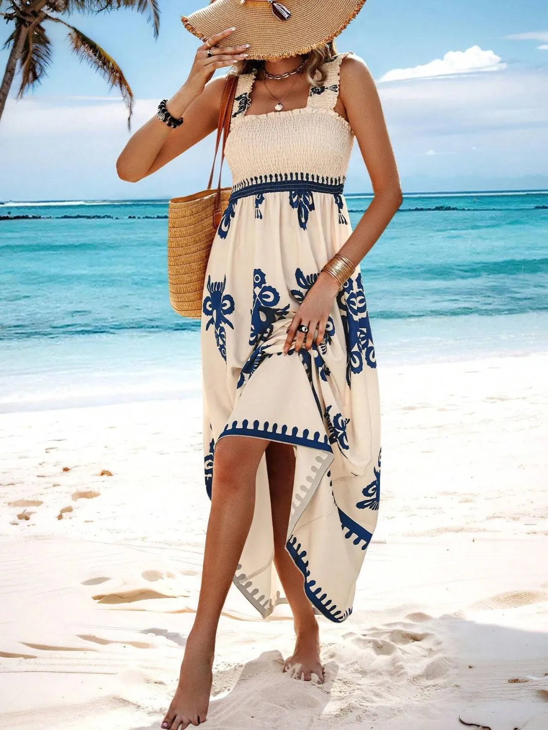 Trendsi Smocked Printed Maxi Dress with Wide Straps - Elegant Opaque, Non-Stretch Design, worn by a woman standing on the beach with a beautiful ocean backdrop.