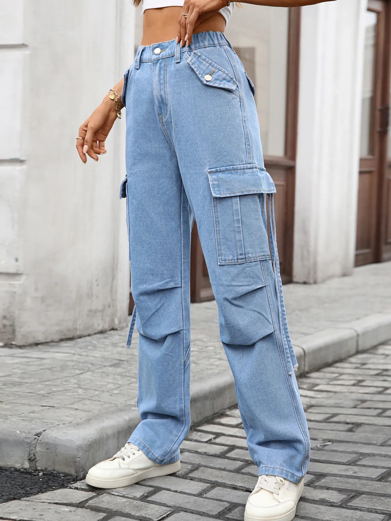 Side view of High Waisted Cargo Pocket Jeans on a model, featuring a relaxed fit and stylish design with cargo pockets.
