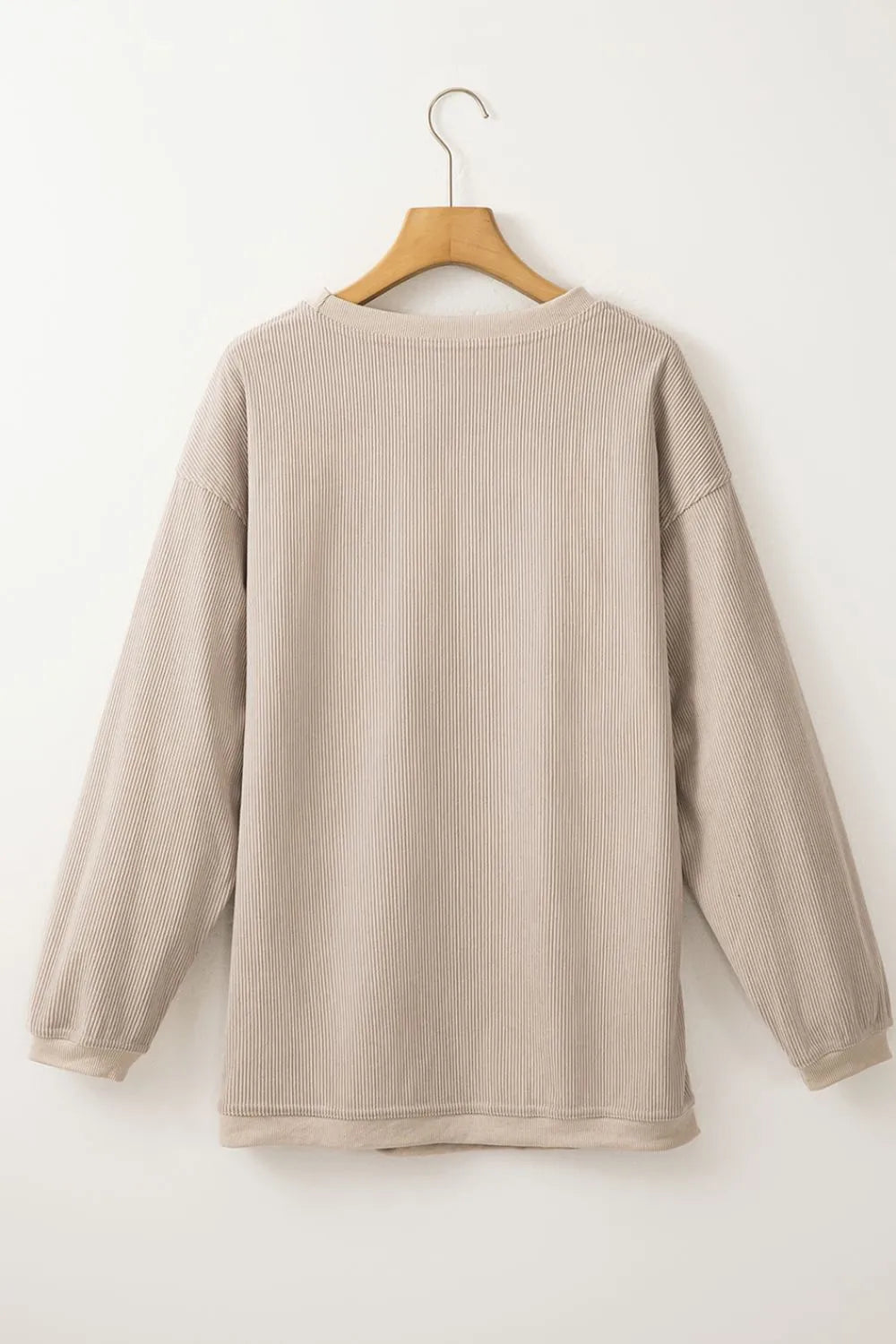 Back view of the Cowgirl Graphic Long Sleeve Sweatshirt showcasing a soft ribbed texture and relaxed fit, perfect for casual wear and layering.