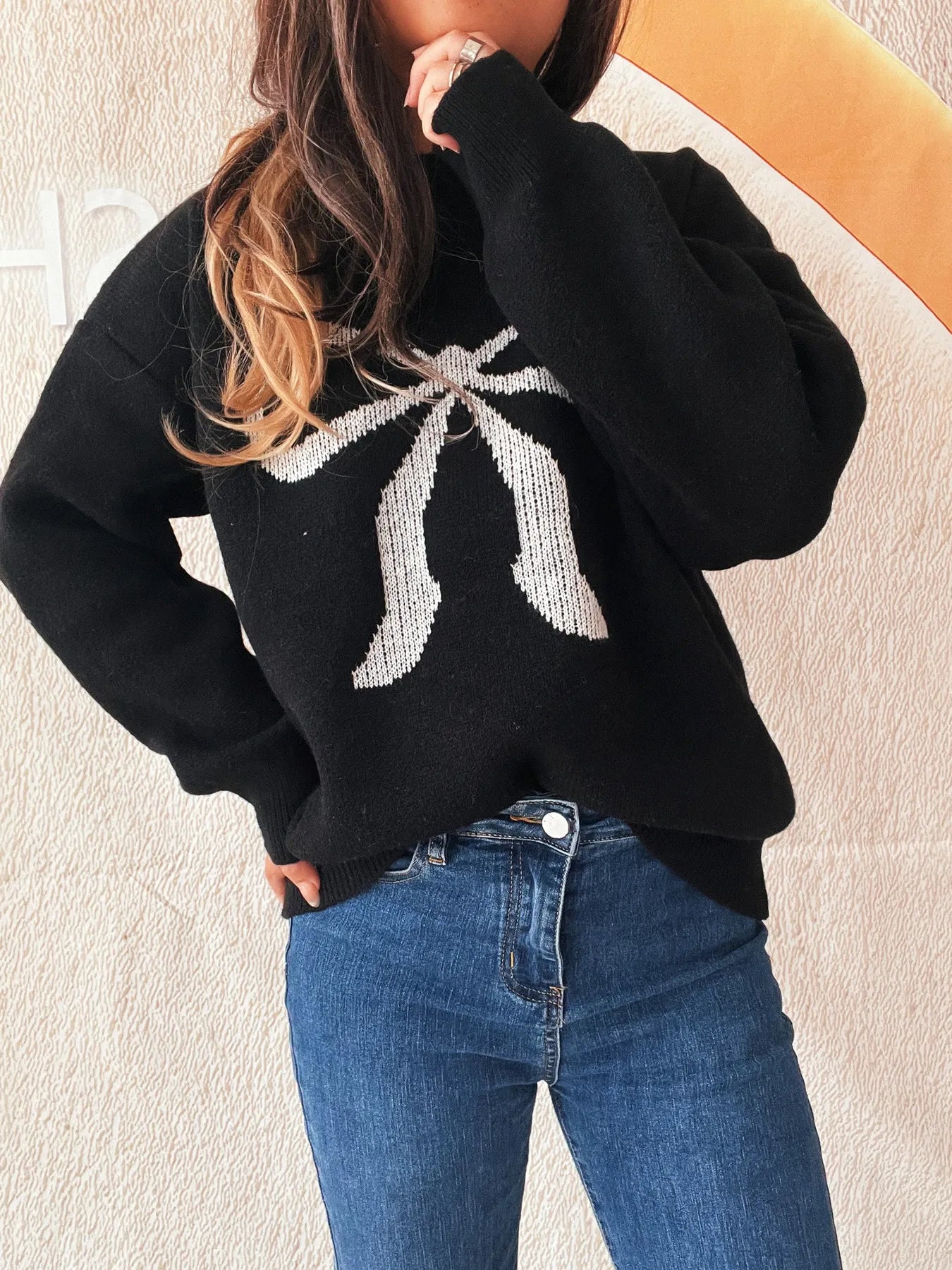 Side view of the Stylish Bow Pattern Casual Long Sleeve Sweater for Effortless Everyday Wear, emphasizing comfort and fashion-forward design.