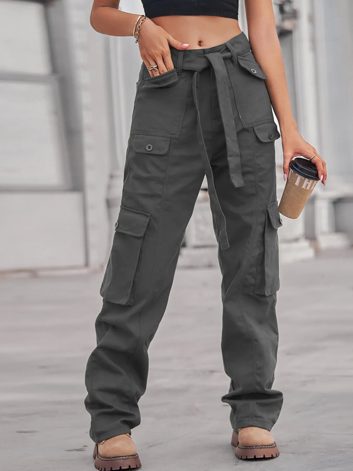 Sophisticated high-waisted multi-pocket cargo jeans in a sleek gray color, exuding a casual yet fashionable vibe.