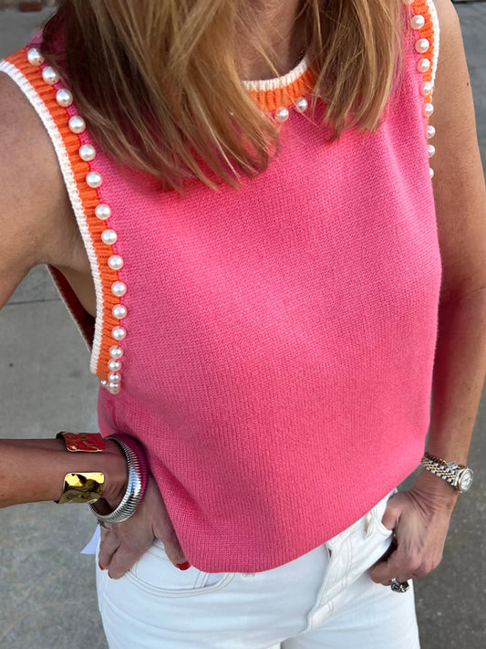 Stylish Contrast Trim Pearl Detail Sweater Tank Top featuring a vibrant pink color, pearl detailing, and an orange contrast trim, worn by a model showcasing a trendy summer look.