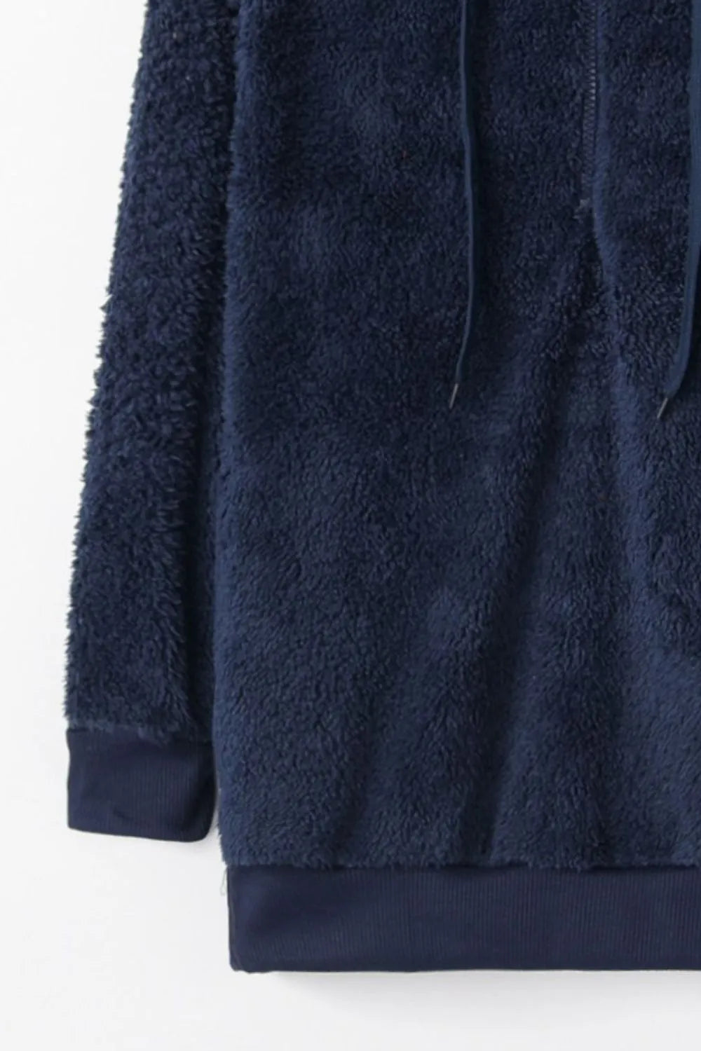 Close-up of the Cozy Full Size Teddy Hoodie with Quarter-Zip and Drawstring in navy blue, detailing its cozy texture and ribbed cuff design.