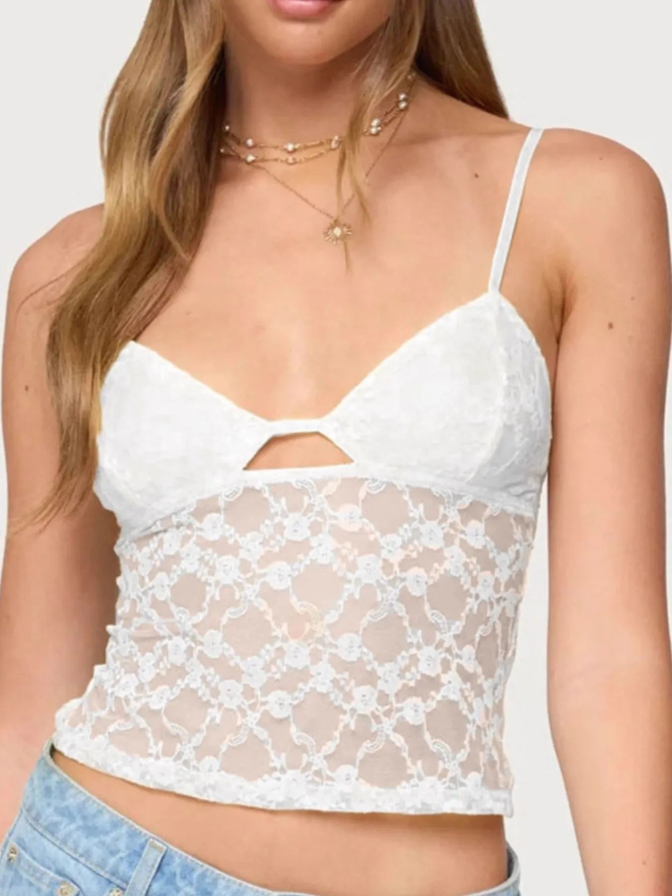 Close-up view of the Trendsi Adjustable Lace Cami Top in white, showcasing the elegant sheer lace details and adjustable straps, ideal for stylish layering.