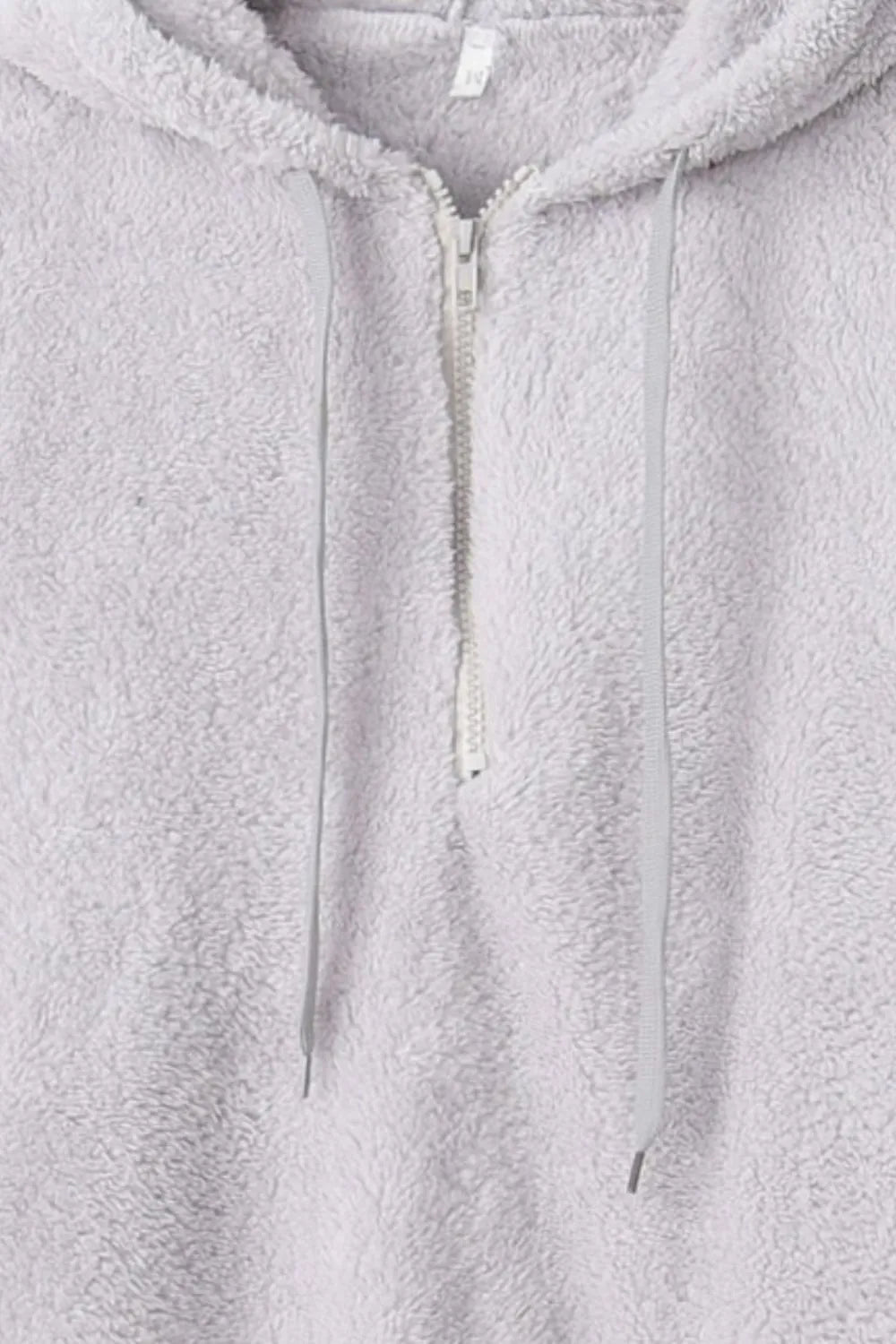 Close-up view of the Cozy Full Size Teddy Hoodie with Quarter-Zip and Drawstring, showcasing the drawstring detail and soft fabric texture.