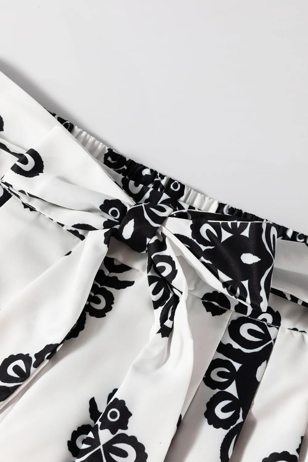 Close-up of the tied waist detail of the Tied Printed Shorts, emphasizing their fashionable design and comfort.