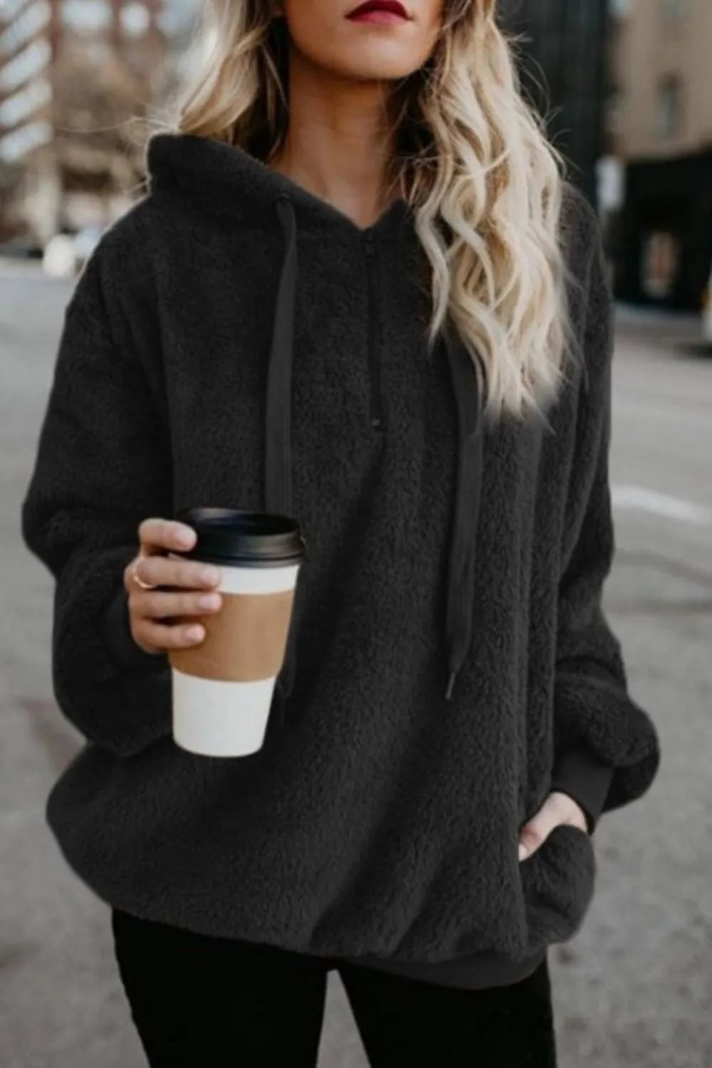 Cozy Full Size Teddy Hoodie with Quarter-Zip and Drawstring in dark gray, worn casually while holding a coffee cup, highlighting its stylish and comfortable appeal.