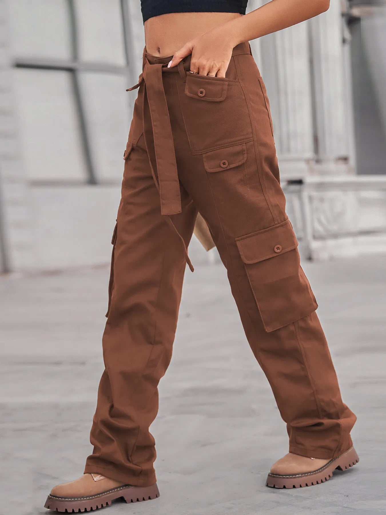 High-Waisted Multi-Pocket Cargo Jeans featuring a model in brown cargo jeans, showcasing the versatility and style of multiple pockets and a fitted waist.