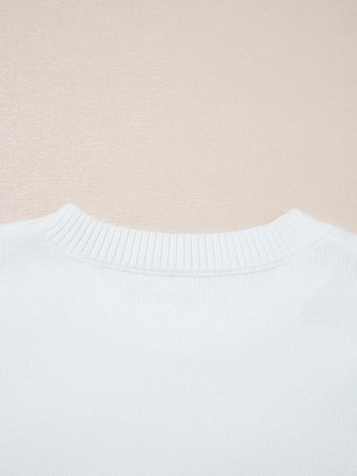 Close-up view of the back neckline of the Western Style Knit Crew Neck Sweater with Horseshoe Star, showcasing its soft fabric and ribbed detail.
