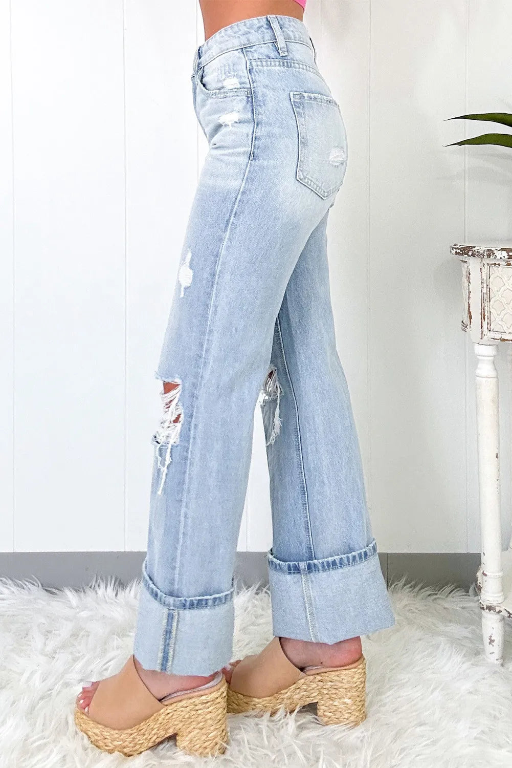 Trendy Distressed High Waist Jeans with Pockets - Slightly Stretchy Comfort Fit, showcasing a side view of the jeans with a relaxed fit and stylish distressed detailing.