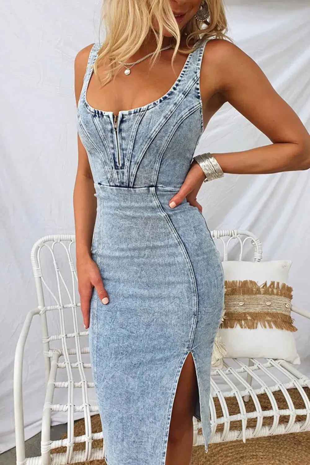 Stylish denim dress with side slit, washed scoop neck design showcasing a fitted silhouette, perfect for casual outings.