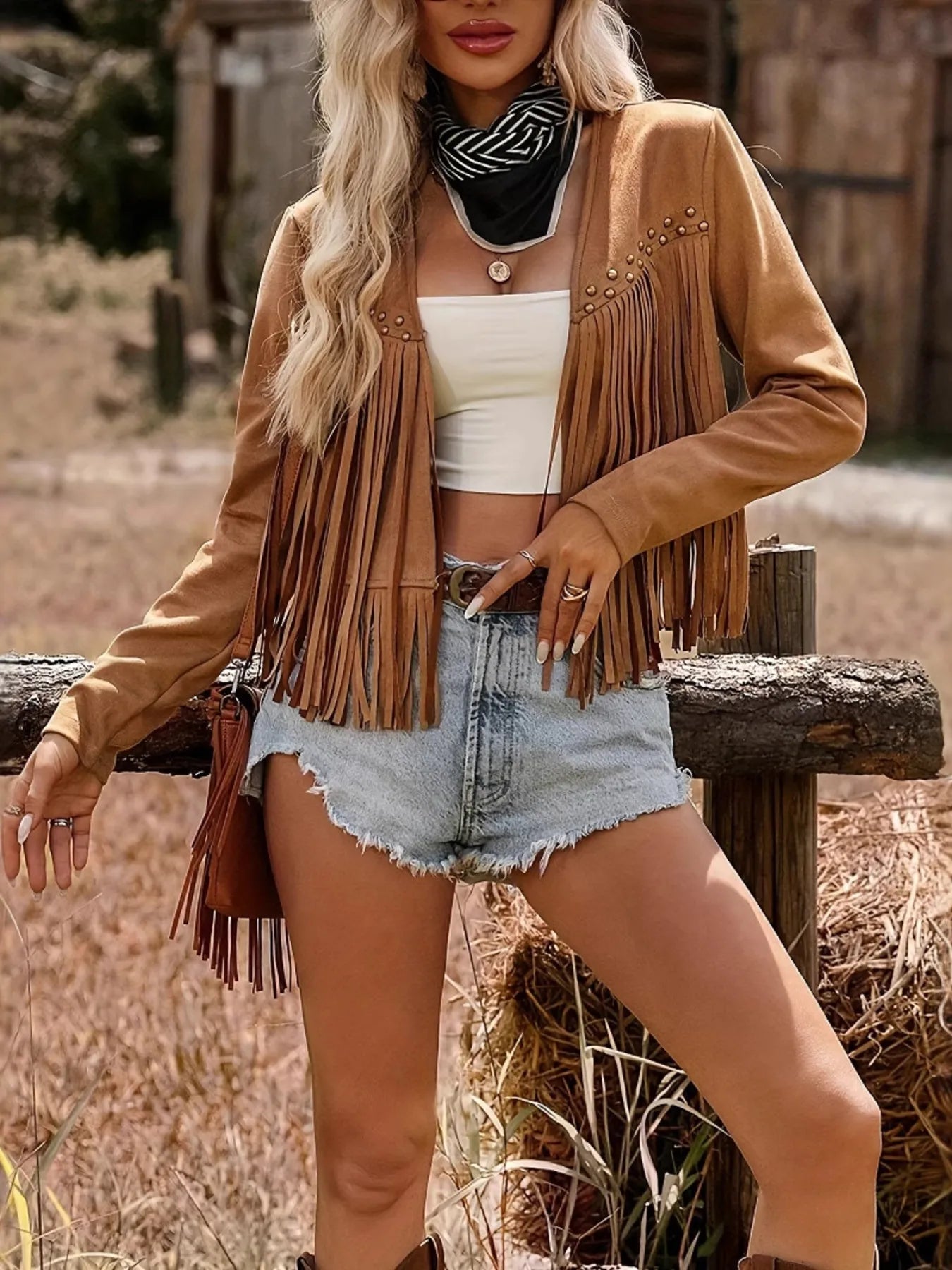 Trendy Fringe Studded Open Front Jacket showcased by a model, styled with a white crop top and denim shorts, perfect for layering in casual summer fashion.