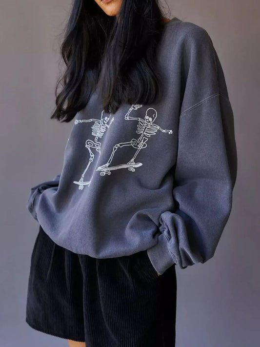 Oversized Skeleton Graphic Sweatshirt for Women featuring a trendy skeleton design skating, made from 100% polyester and slightly stretchy fabric.