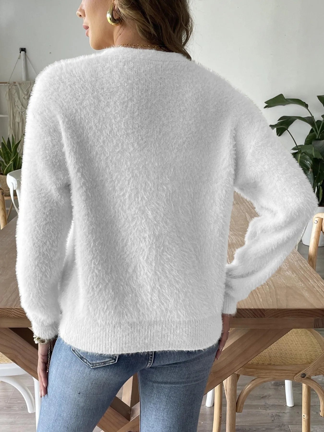 Back view of the Trendsi Fuzzy Button-Front Cardigan in white, highlighting its plush texture and relaxed fit.