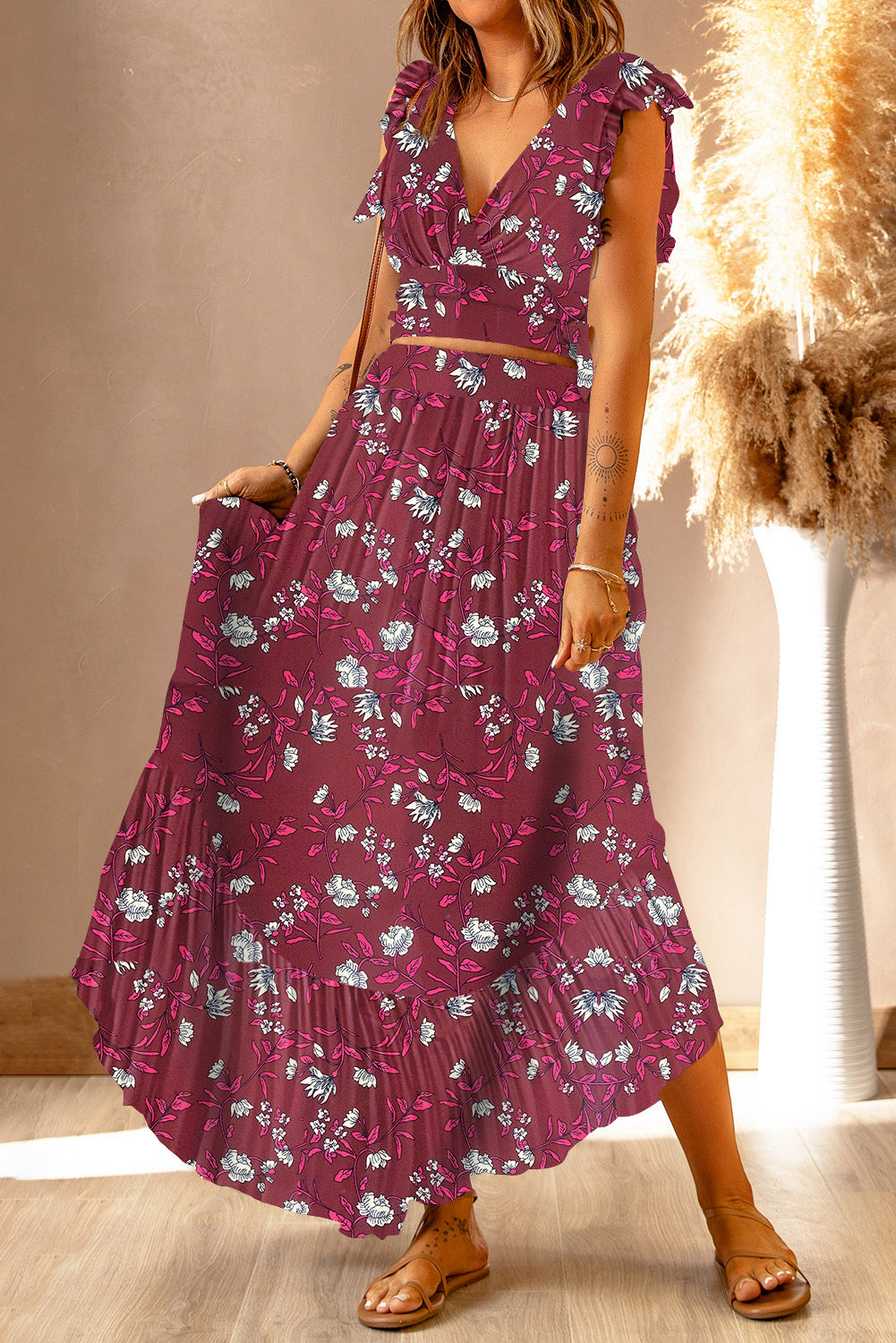 Model in a vibrant Floral Print Tie-Back Cropped Top & Maxi Skirt Set, capturing a chic summer outfit with bold floral design, set in an elegant indoor setting.
