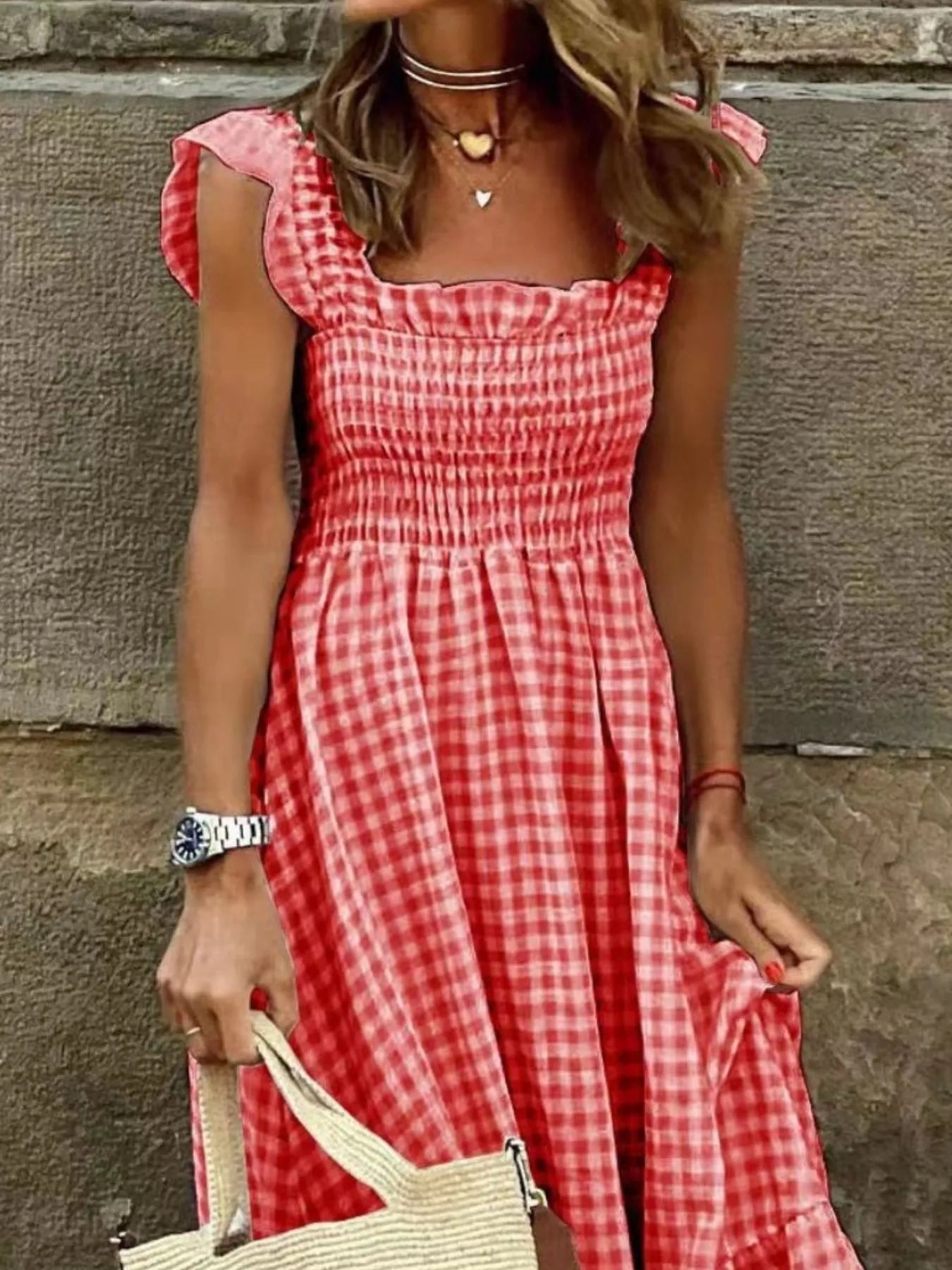 Detailed view of a Gingham Maxi Dress with Ruffle Straps, Smocked Bodice & Tiered Design in red and white, capturing the beautiful fabric and fit.