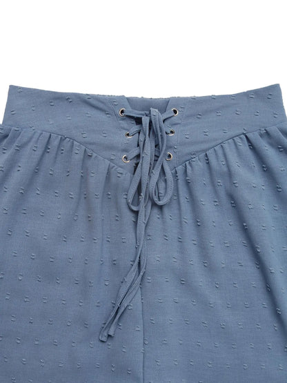 Swiss Dot Lace Up Shorts - Close-up view showcasing lace-up detail and soft texture.