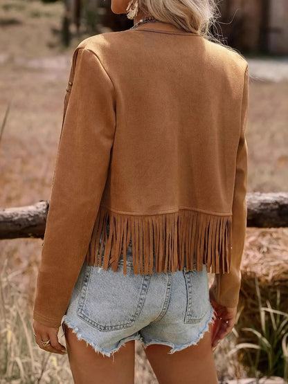 Back view of the model wearing the Trendy Fringe Studded Open Front Jacket, showcasing the fringe detail and overall stylish design, paired with denim shorts.