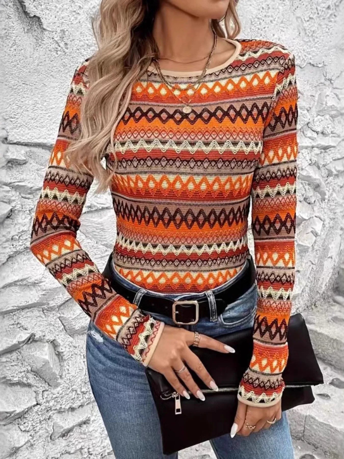 Trendy Bohemian Geometric Long Sleeve T-Shirt showcased with a chic belt and clutch, highlighting its colorful geometric design for a fashionable look.