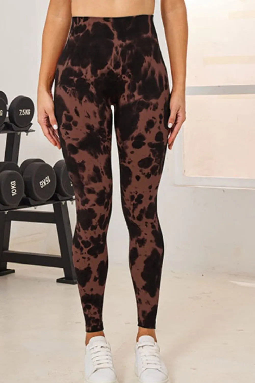 Slightly Stretchy Tie-Dye High Waist Active Leggings in brown, featured from the front against a backdrop of gym weights.