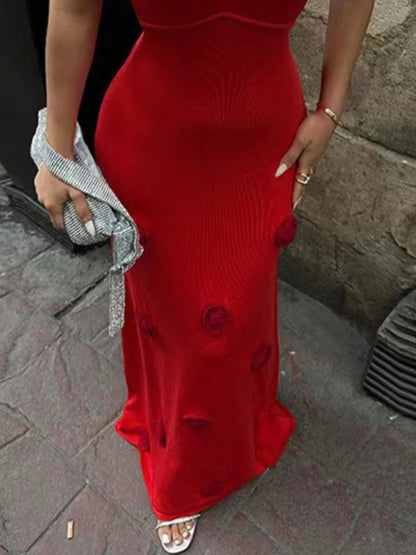 Close-up shot of the red backless flower print maxi sweater cami dress, featuring beautiful flower details and a sleek silhouette. Perfect for making a bold statement while enjoying a night out.